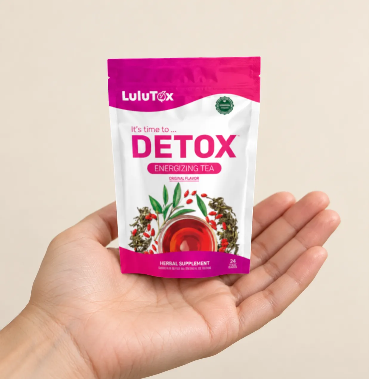 Lulutox Detox Tea — the package held in a hand