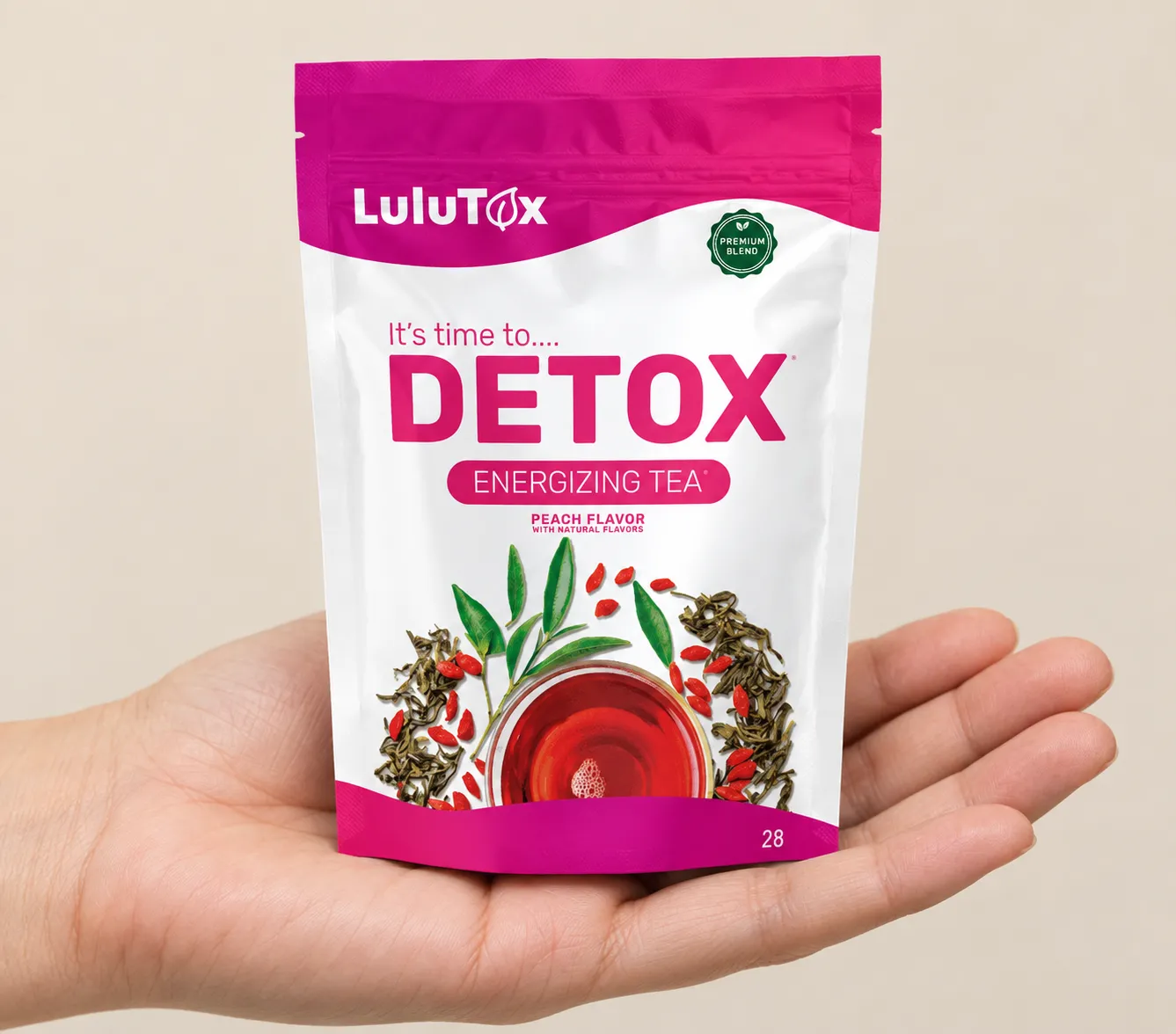 Lulutox Detox Tea HCTC — the package held in a hand